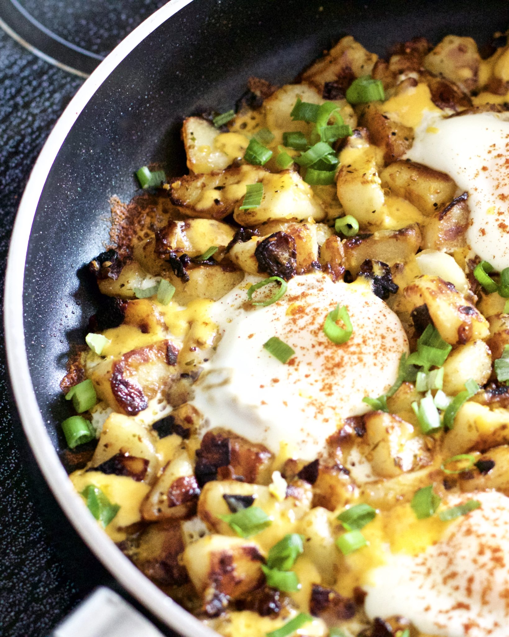 Gluten-Free Breakfast Hash - Scrumptious, hearty, full of protein breakfast hash that is sure to coat the stomach. Super easy to make, and oh so cheesy! Recipe | Quick | Eggs | Breakfast | Brunch | Lunch | One Pan | Potatoes | Cheese | Potato Hash | Poached | Over Easy | Potato Egg Hash | Easy Recipes | Gluten-Free Breakfast | Breakfast Skillet | Fried Potatoes | Hashbrowns | Potato Hashbrown |