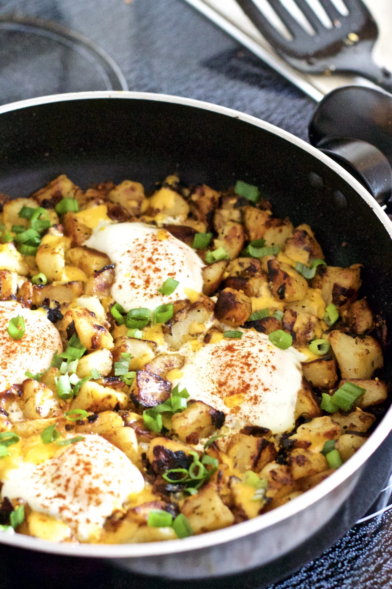 Gluten-Free Breakfast Hash - Scrumptious, hearty, full of protein breakfast hash that is sure to coat the stomach. Super easy to make, and oh so cheesy! Recipe | Quick | Eggs | Breakfast | Brunch | Lunch | One Pan | Potatoes | Cheese | Potato Hash | Poached | Over Easy | Potato Egg Hash | Easy Recipes | Gluten-Free Breakfast | Breakfast Skillet | Fried Potatoes | Hashbrowns | Potato Hashbrown |