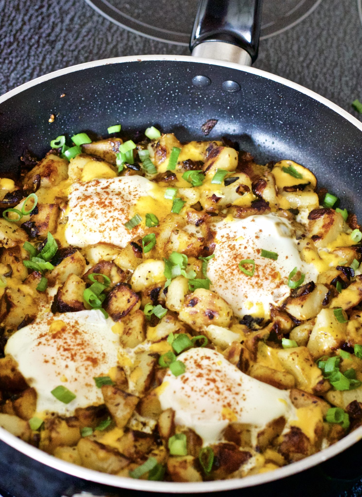 Gluten-Free Breakfast Hash - Scrumptious, hearty, full of protein breakfast hash that is sure to coat the stomach. Super easy to make, and oh so cheesy! Recipe | Quick | Eggs | Breakfast | Brunch | Lunch | One Pan | Potatoes | Cheese | Potato Hash | Poached | Over Easy | Potato Egg Hash | Easy Recipes | Gluten-Free Breakfast | Breakfast Skillet | Fried Potatoes | Hashbrowns | Potato Hashbrown |