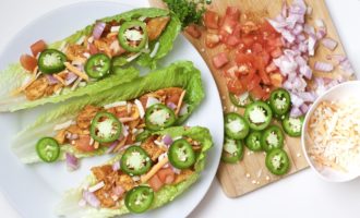 Light, crispy and delicious Buffalo Chicken Lettuce Tacos are made in 20 minutes or less. An easy, gluten-free, low carb, keto and paleo recipe. Enjoy the wraps as an appetizer or main dish. Mexican Recipes | Lettuce Tacos | Chicken Tacos | Spicy | Hot Sauce | Summer Recipe | Game Night | Date Night | Dinner | Low Carb | Ketogenic | Keto | Weight Loss | Buffalo Chicken | Paleo | Easy Dinner | Salad | Romain Lettuce | Lettuce Taco Shells |