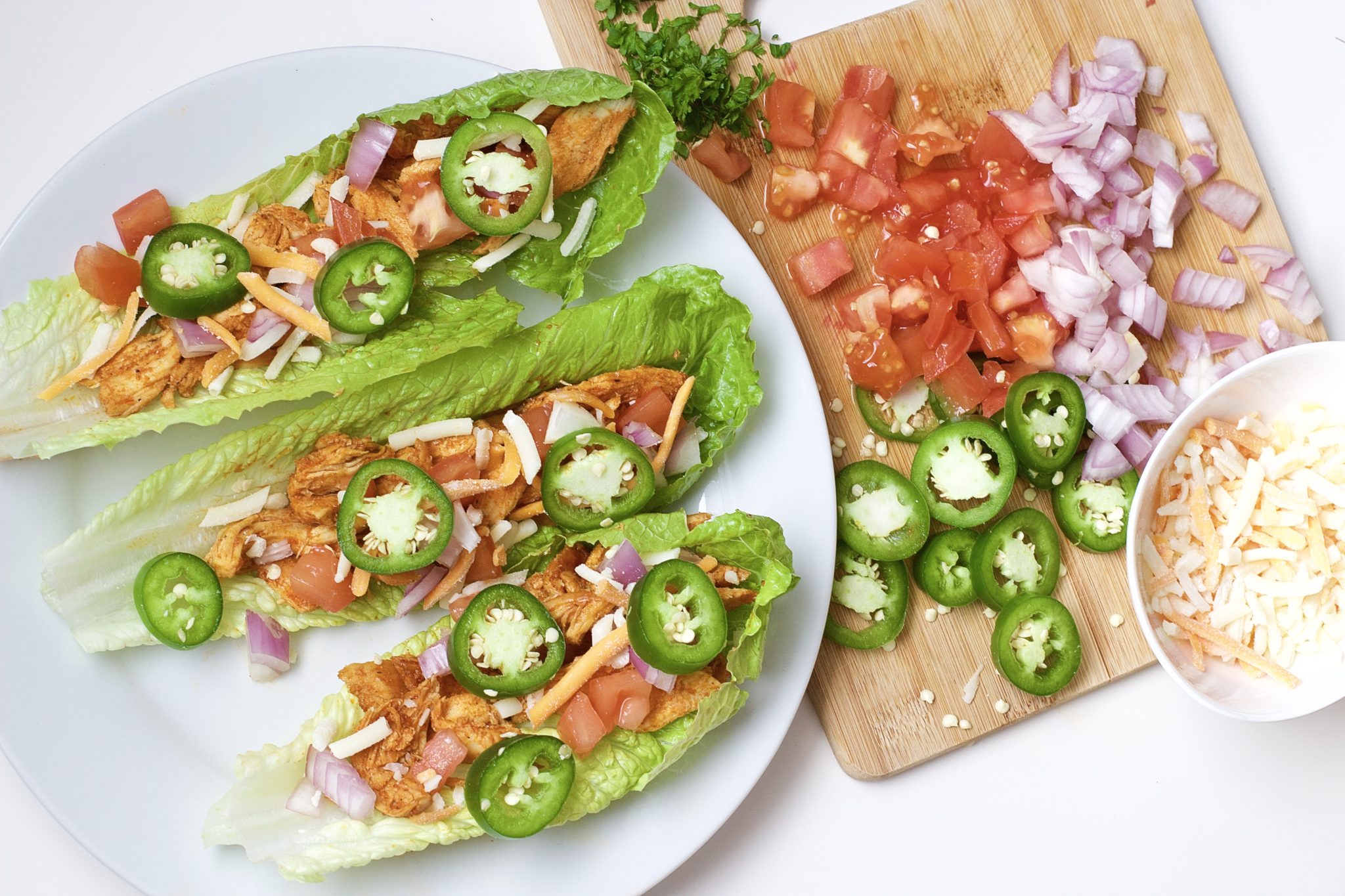 Light, crispy and delicious Buffalo Chicken Lettuce Tacos are made in 20 minutes or less. An easy, gluten-free, low carb, keto and paleo recipe. Enjoy the wraps as an appetizer or main dish. Mexican Recipes | Lettuce Tacos | Chicken Tacos | Spicy | Hot Sauce | Summer Recipe | Game Night | Date Night | Dinner | Low Carb | Ketogenic | Keto | Weight Loss | Buffalo Chicken | Paleo | Easy Dinner | Salad | Romain Lettuce | Lettuce Taco Shells | Lettuce Wraps |