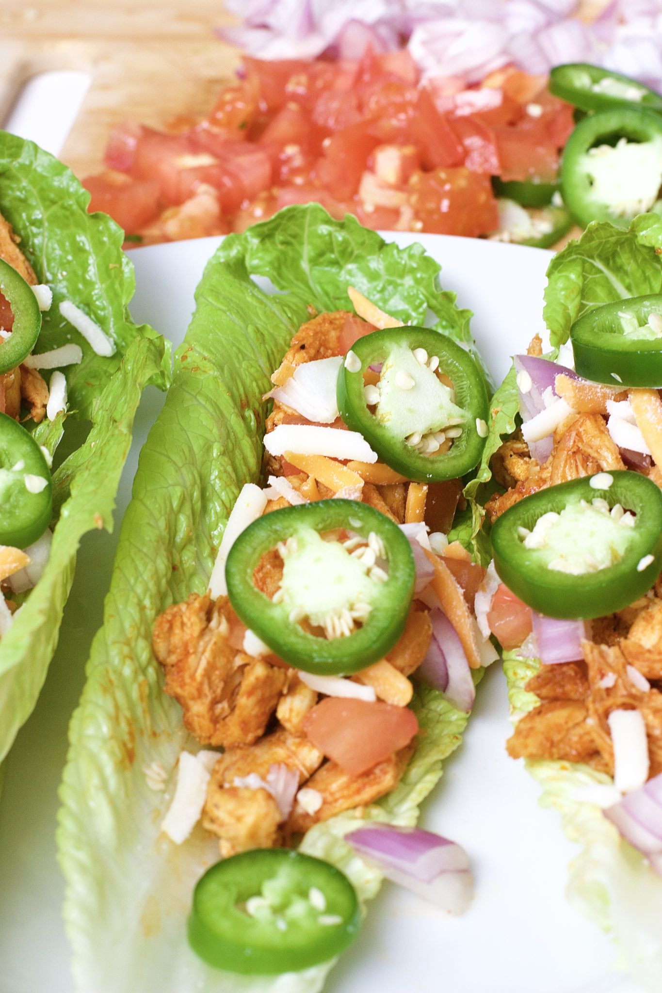 Light, crispy and delicious Buffalo Chicken Lettuce Tacos are made in 20 minutes or less. An easy, gluten-free, low carb, keto and paleo recipe. Enjoy the wraps as an appetizer or main dish. Mexican Recipes | Lettuce Tacos | Chicken Tacos | Spicy | Hot Sauce | Summer Recipe | Game Night | Date Night | Dinner | Low Carb | Ketogenic | Keto | Weight Loss | Buffalo Chicken | Paleo | Easy Dinner | Salad | Romain Lettuce | Lettuce Taco Shells | Lettuce Wraps |