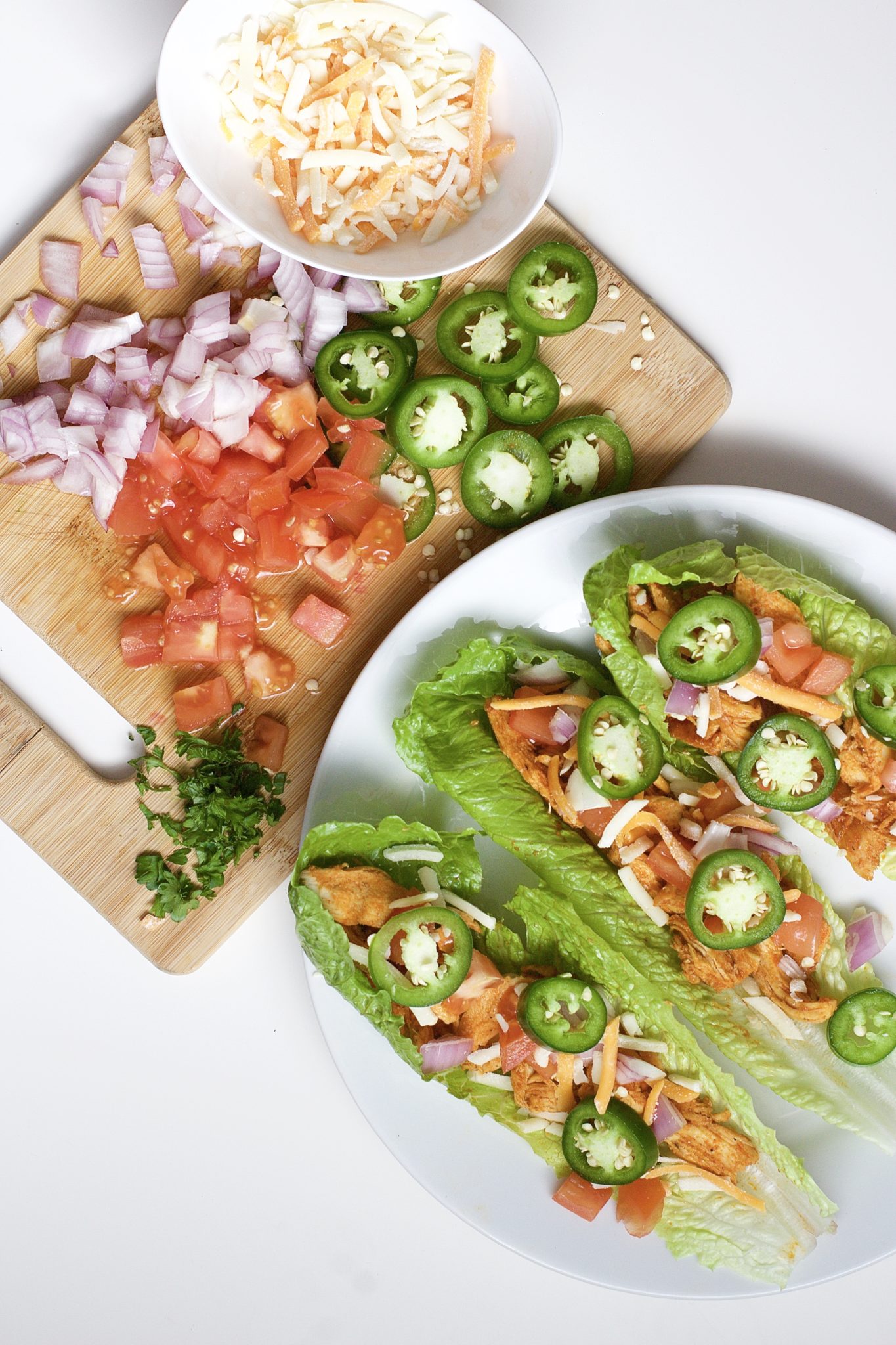 Light, crispy and delicious Buffalo Chicken Lettuce Tacos are made in 20 minutes or less. An easy, gluten-free, low carb, keto and paleo recipe. Enjoy the wraps as an appetizer or main dish. Mexican Recipes | Lettuce Tacos | Chicken Tacos | Spicy | Hot Sauce | Summer Recipe | Game Night | Date Night | Dinner | Low Carb | Ketogenic | Keto | Weight Loss | Buffalo Chicken | Paleo | Easy Dinner | Salad | Romain Lettuce | Lettuce Taco Shells | Lettuce Wraps |