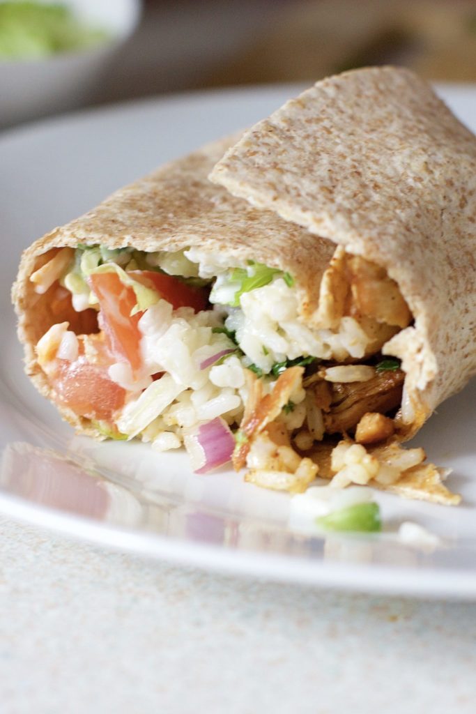 Make Mexican night fun and delicious with this easy burrito recipe. Light and lean, involves gluten-free pita bread for the wraps and tons of protein and fibre. Enjoy for lunch, dinner, or after a workout! A healthy, family friendly recipe. Gluten-Free Dinner Recipe | Gluten-Free Burritos | Rice and Beans | Cilantro Lime Rice | Mexican Dinner Recipe | Mexican Recipes | Healthy | Chicken Burritos | Homemade Burritos | Homemade Taco Seasoning | 