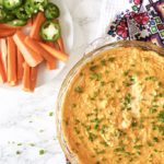Entertain with this incredibly cheesy buffalo chicken wing dip - delicious, keto and low carb appetizer perfect for game night or a party! Party Food | Healthy | Low Carb | Keto | Appetizer | Keto Dip | Veggie Dip | Spicy | Buffalo Wing Dip | Chicken Wing Dip | Camping Food | Game Night Recipe | Cheesy Dip | Gluten-Free |