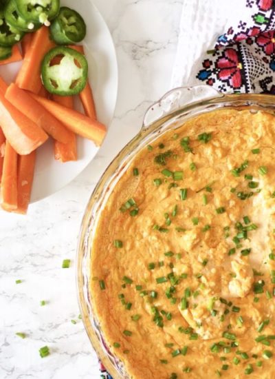 Entertain with this incredibly cheesy buffalo chicken wing dip - delicious, keto and low carb appetizer perfect for game night or a party! Party Food | Healthy | Low Carb | Keto | Appetizer | Keto Dip | Veggie Dip | Spicy | Buffalo Wing Dip | Chicken Wing Dip | Camping Food | Game Night Recipe | Cheesy Dip | Gluten-Free |