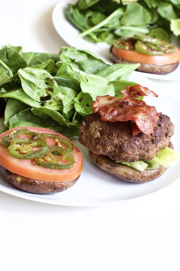 Portobello Mushroom Bacon Burgers are extremely juicy, delicious, and healthy. The ultimate paleo meal that's low carb, keto friendly and high in protein. Gluten Free | No Bread | Homemade Burgers | Gluten-Free Burgers | Keto Burgers | Homemade Hamburgers | Weight Loss | Dinner | BBQ Recipe | Grilling | Grilled Burgers | Bacon Burgers | Paleo | Whole 30 | Sugar Free Ketchup | Bun Replacement | Bread Replacement | Mushrooms | 