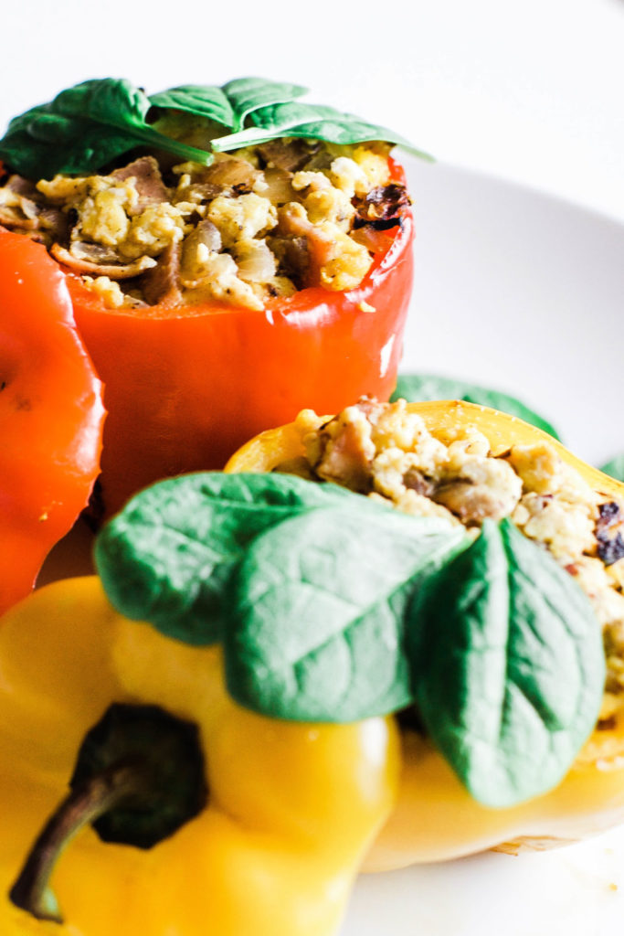 These scrambled egg stuffed peppers are easy, healthy, and extremely satisfying! A low-carb and whole 30 breakfast to start your day right! High protein | Whole 30 Breakfast | Paleo Breakfast | Sugar Free | Refined Sugar Free | Gluten-Free Breakfast | Brunch | Weight Loss | Nutrition | Nutritious | Quick and Easy | Wholesome | Filling | Scrambled Eggs | Lean | Turkey Bacon | Spinach | Oven Baked | Baked Eggs | Egg Cups | Keto Breakfast | Ketogenic Diet | Keto Food |