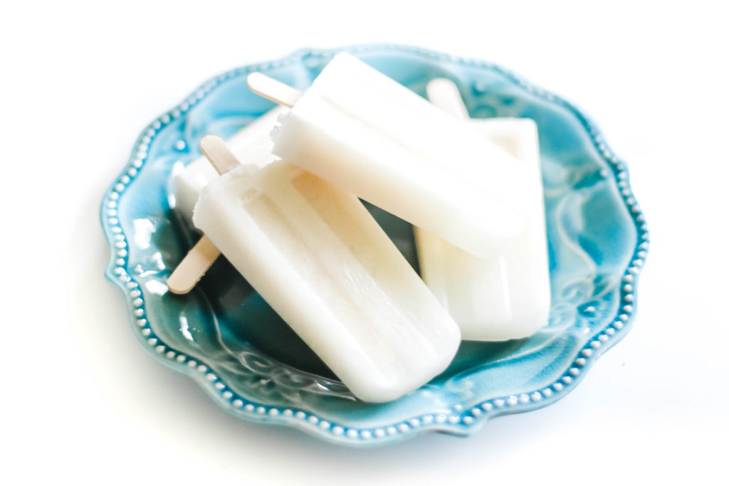 Creamy, healthy, refreshing, and extremely easy to make with only 3 ingredients! Keep it virgin for the kids! Ice Pops | Popsicles | Dairy Free | Pina Colada Recipe | Popsicle Molds | Homemade | From Scratch | Boozy | Alcohol | Summer | Vegan | Paleo | Whole 30 | Weight loss | Healthy Snacks | Snacks for Kids | Popsicle Recipe | Coconut | Pineapple | Sugar Free | 