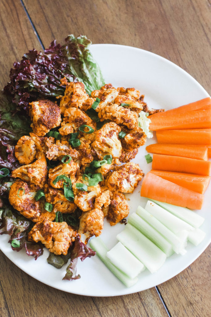 Cauliflower Buffalo Wings are low carb, crispy, and have the perfect amount of hotness. Enjoy at dinner, on game night, or serve them as a tasty appetizer! Vegan Wings | Paleo | Whole 30 | Dinner Recipes | Easy Dinners | Dinner Ideas | Appetizers | Side Dish | Spicy | Mexican | Veggies | Fibre | Low Calorie | Gluten Free | Grain Free | Plant Based | Clean Recipes | Cauliflower Bites | Buffalo Wing | Hot Sauce | Crispy | Oven Baked | Healthy Eating Ideas |