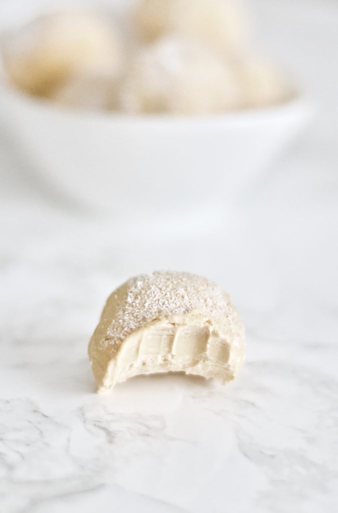 Stay in ketosis this Christmas with these frosted cheesecake fat bombs. They're absolutely scrumptious, easy to make, low carb, sugar free, and gluten-free! 3 Ingredients | Keto Desserts | Dessert Recipe | Low Carb | Weight Loss | High Fat | Healthy Fats | Keto Friendly | No Bake | Frozen | Peanut Butter | Treat | Balls | Sugar Free | Gluten Free | Holiday Recipes | Christmas Dessert | Christmas Recipe | Snow | Snowball | Easy Recipes | Keto Snacks | Bite Sized | 