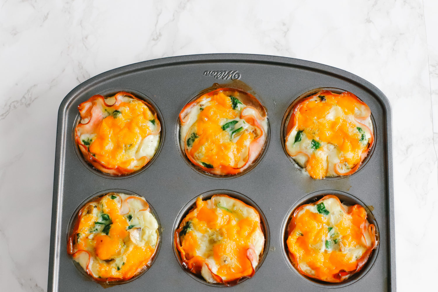 Keto and low carb egg cups are easy to prepare and great for a quick, on-the-go breakfast. Store in the fridge or freezer, reheat, and enjoy. Keto Breakfast Recipes | Low Carb Recipe | Egg Whites | Ham and Egg Cups | Easy Recipes | Fat Burn | Weight Loss | Low Calorie | Gluten-Free | Sugar Free | Whole 30 | Paleo | Kid-Friendly | Quick and Easy |