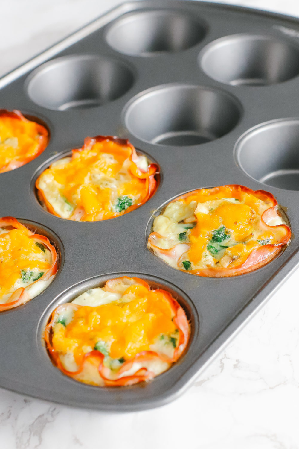 Keto and low carb egg cups are easy to prepare and great for a quick, on-the-go breakfast. Store in the fridge or freezer, reheat, and enjoy. Keto Breakfast Recipes | Low Carb Recipe | Egg Whites | Ham and Egg Cups | Easy Recipes | Fat Burn | Weight Loss | Low Calorie | Gluten-Free | Sugar Free | Whole 30 | Paleo | Kid-Friendly | Quick and Easy |