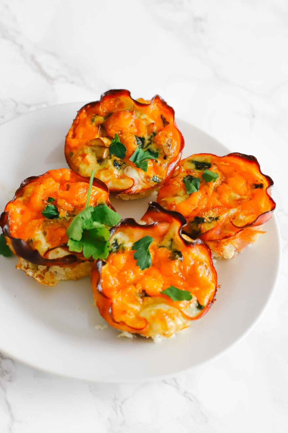 Keto and low carb egg cups are easy to prepare and great for a quick, on-the-go breakfast. Store in the fridge or freezer, reheat, and enjoy. Keto Breakfast Recipes | Low Carb Recipe | Egg Whites | Ham and Egg Cups | Easy Recipes | Fat Burn | Weight Loss | Low Calorie | Gluten-Free | Sugar Free | Whole 30 | Paleo | Kid-Friendly | Quick and Easy |