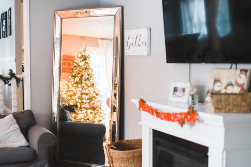 This is our living room home tour with minimal, cozy, and affordable Christmas decorations for the holiday season. I'll be linking everything from our rug, furniture, and accents, to our Christmas tree and electric fireplace. Home Design | Home Decor | Christmas Decor | Christmas Decorations | Deck The Halls | Holiday Decorating | Xmas Tree | Ikea Ektorp Sofa | Nordvalla Grey | Hemnes Sofa Table | TV on Top of Fireplace | Mantel |