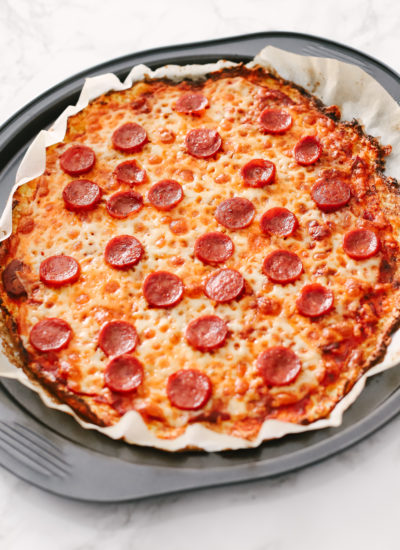 The best cauliflower pepperoni pizza recipe you will ever need to get your pizza fix without the guilt on a low carb, ketogenic diet. It's gluten-free with tons of nutrients and perfect for weight loss. Cauliflower Crust | Cauliflower Pizza | Low Carb | Keto | Keto Dinner Recipe | Easy Pizza Recipe | Healthy Pizza | Super Food Pizza | Keto Food | Keto Dinners | Gluten-Free Pizza | Think Crust | Cheese Pizza |