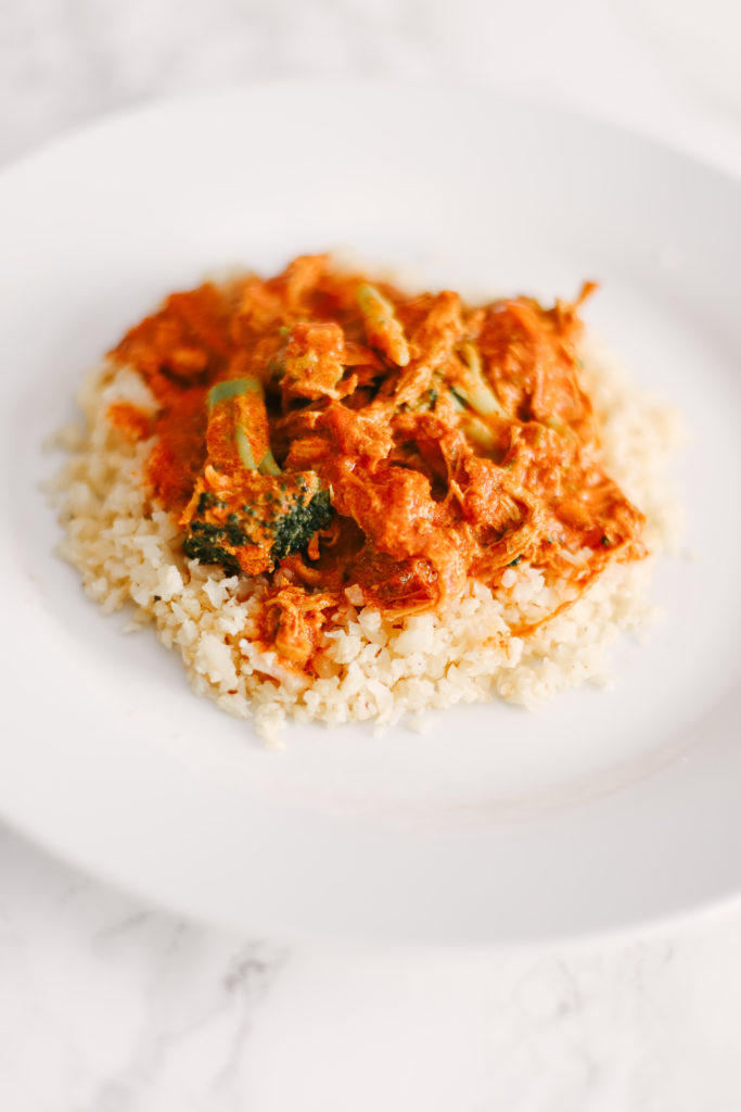 Homemade Slow Cooker Butter Chicken on top of cauliflower rice is sugar free, grain free, dairy free, and low carb. Powerful ingredients for optimal health and weight loss. Keto Butter Chicken | Dinner | Entrees | Slow Cooker | Crock Pot | Indian Cuisine | Healthy | Weight Loss | Ketogenic | Gluten-Free | Whole 30 | Paleo | Kid Friendly | Homemade | Butter Chicken Sauce | Family Dinner | Easy Slow Cooker Recipe | Broccoli and Chicken | Entree Dish |