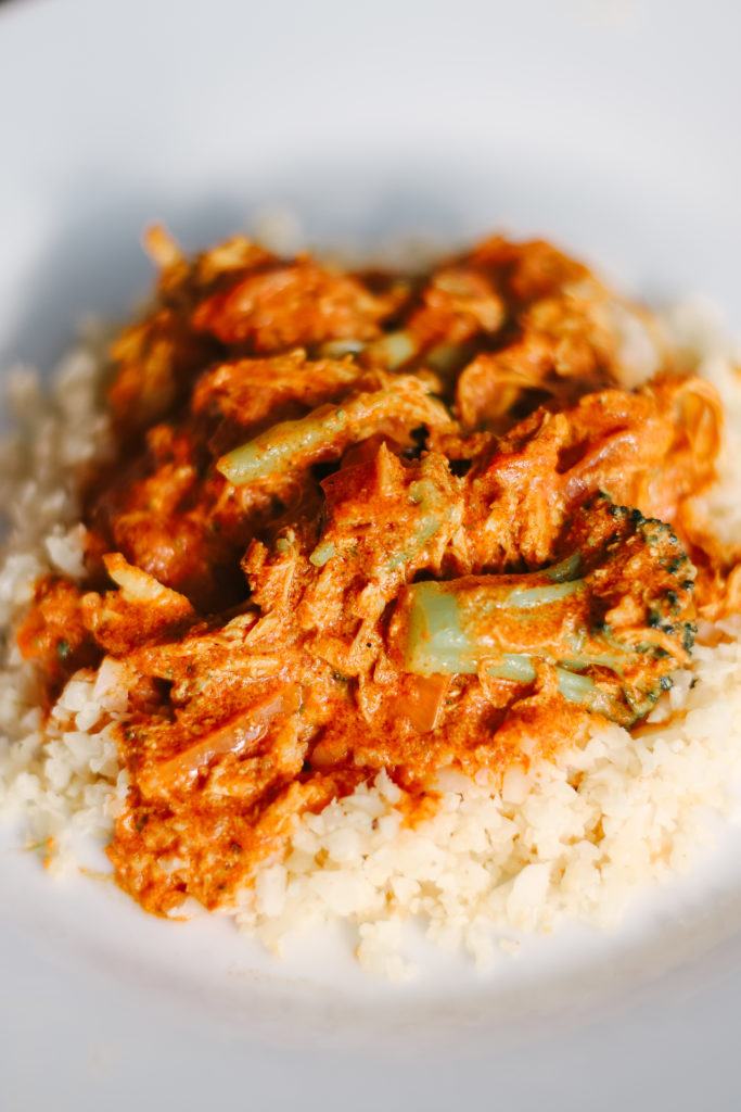 Homemade Slow Cooker Butter Chicken on top of cauliflower rice is sugar free, grain free, dairy free, and low carb. Powerful ingredients for optimal health and weight loss. Keto Butter Chicken | Dinner | Entrees | Slow Cooker | Crock Pot | Indian Cuisine | Healthy | Weight Loss | Ketogenic | Gluten-Free | Whole 30 | Paleo | Kid Friendly | Homemade | Butter Chicken Sauce | Family Dinner | Easy Slow Cooker Recipe | Broccoli and Chicken | Entree Dish |