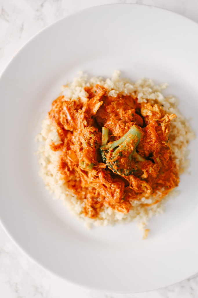 Homemade Slow Cooker Butter Chicken on top of cauliflower rice is sugar free, grain free, dairy free, and low carb. Powerful ingredients for optimal health and weight loss. Keto Butter Chicken | Dinner | Entrees | Slow Cooker | Crock Pot | Indian Cuisine | Healthy | Weight Loss | Ketogenic | Gluten-Free | Whole 30 | Paleo | Kid Friendly | Homemade | Butter Chicken Sauce | Family Dinner | Easy Slow Cooker Recipe | Broccoli and Chicken | Entree Dish |