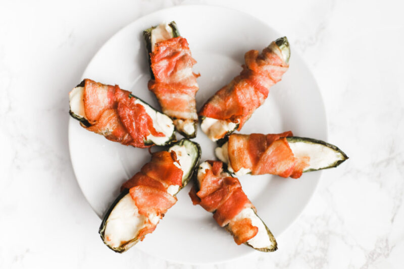 Keto bacon wrapped, cream cheese stuffed jalapeños are quick and easy to make, baked in the oven to perfection! A gluten-free, low carb snack or appetizer. Mexican Food | Keto Jalapenos | Stuffed Jalapenos | Keto Jalapeno Poppers | Bacon Wrapped Jalapenos | Weight Loss | Ketogenic | Ketos Snacks | Keto Recipes | Baked Jalapenos | Easy Keto |