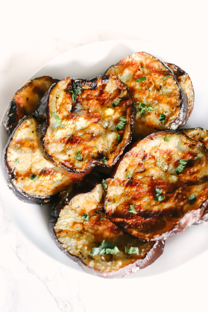 Garlic Parmesan Grilled Eggplant is melt-in-your-mouth delicious, the best BBQ recipe and side dish you will ever make! Easy, healthy, low carb, and keto friendly. Healthy Side Dishes | Dinner Recipes | BBQ Recipes | Eggplant Recipes | Grilling | Sides | BBQ'd Eggplant | Ketogenic | Weight Loss | Keto Dinner | Easy | Simple | Grilled Veggies | Barbecue | Barbecued | 