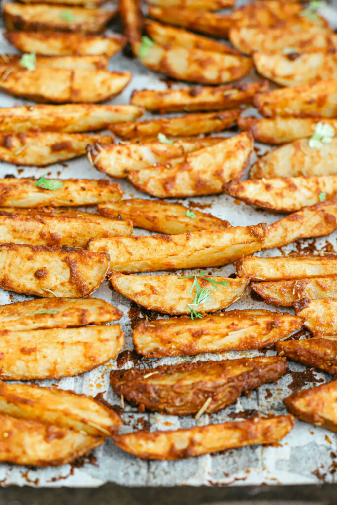 The best parmesan crusted wedges with seasoned roasted potatoes, freshly cut to perfection for the perfect dinner side dish or snack. Gluten-Free | Potato Side Dishes | Fresh Cut Fries | Potato Wedges | Rosemary | Seasoned Potatoes | Homemade Wedges | Baked Potato Wedges | Crispy Potatoes | Comfort Food | Potato Recipe | Appetizer | 
