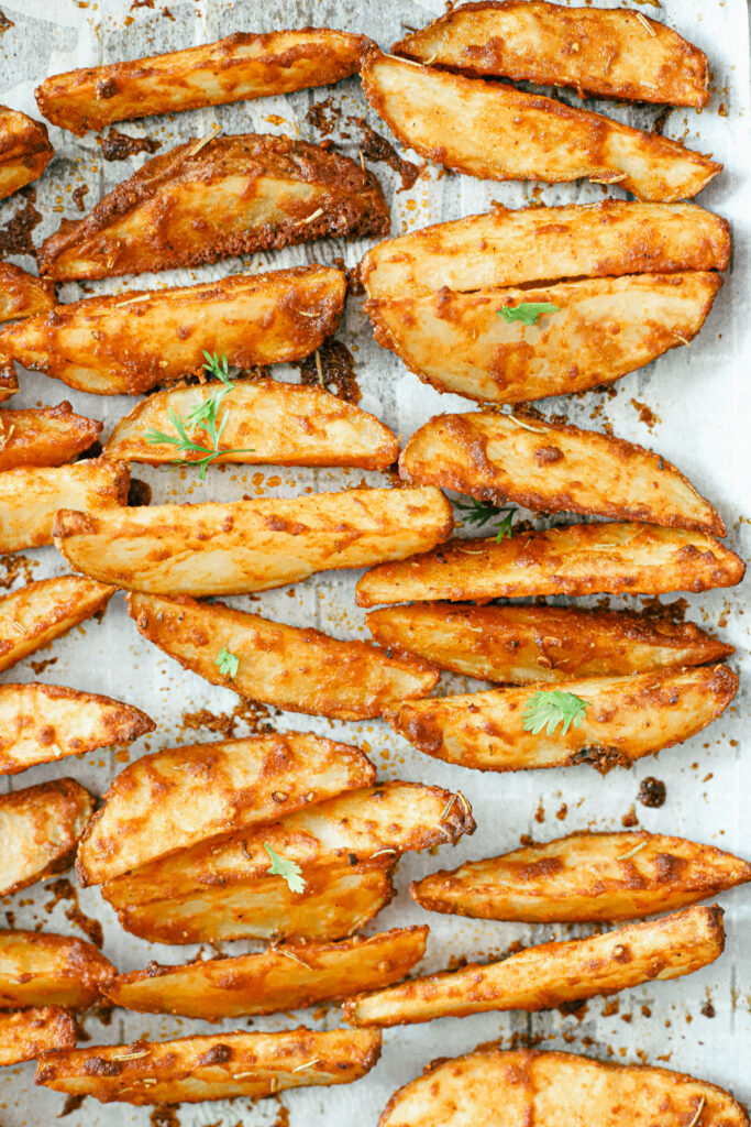 The best parmesan crusted wedges with seasoned roasted potatoes, freshly cut to perfection for the perfect dinner side dish or snack. Gluten-Free | Potato Side Dishes | Fresh Cut Fries | Potato Wedges | Rosemary | Seasoned Potatoes | Homemade Wedges | Baked Potato Wedges | Crispy Potatoes | Comfort Food | Potato Recipe | Appetizer |