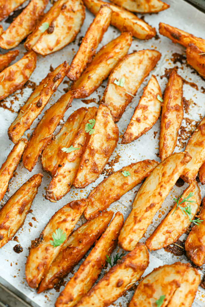 The best parmesan crusted wedges with seasoned roasted potatoes, freshly cut to perfection for the perfect dinner side dish or snack. Gluten-Free | Potato Side Dishes | Fresh Cut Fries | Potato Wedges | Rosemary | Seasoned Potatoes | Homemade Wedges | Baked Potato Wedges | Crispy Potatoes | Comfort Food | Potato Recipe | Appetizer |