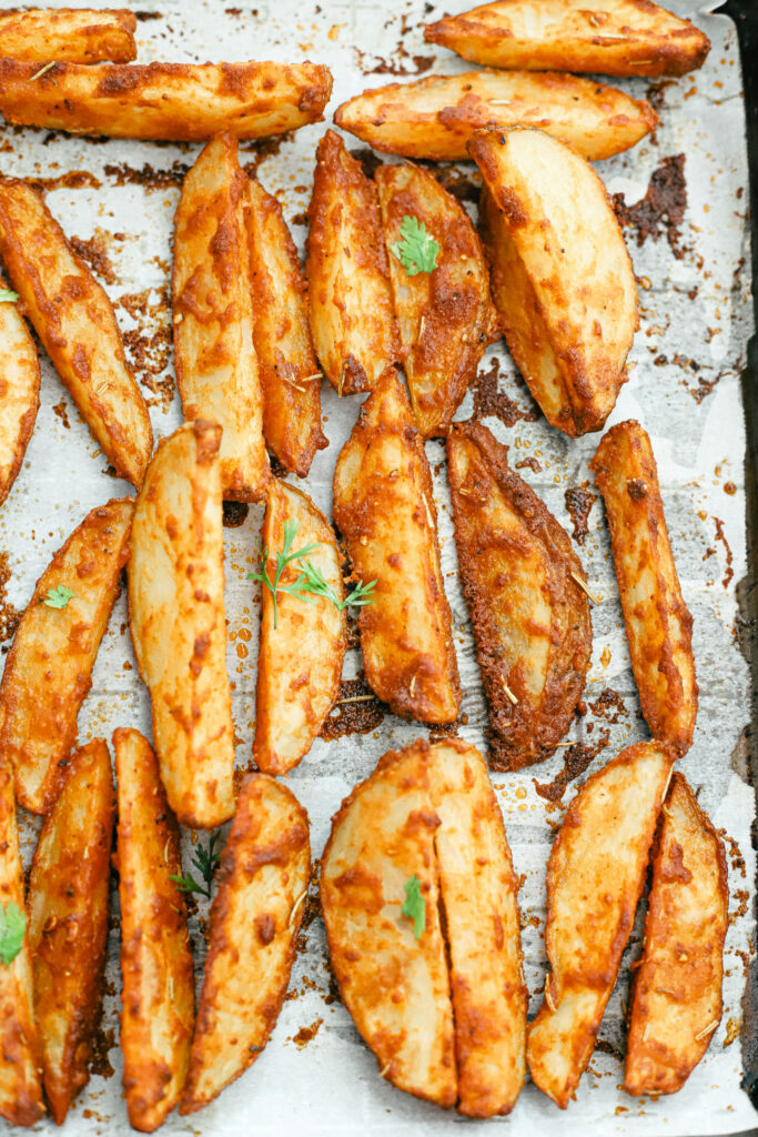 The best parmesan crusted wedges with seasoned roasted potatoes, freshly cut to perfection for the perfect dinner side dish or snack. Gluten-Free | Potato Side Dishes | Fresh Cut Fries | Potato Wedges | Rosemary | Seasoned Potatoes | Homemade Wedges | Baked Potato Wedges | Crispy Potatoes | Comfort Food | Potato Recipe | Appetizer |