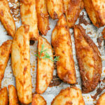 The best parmesan crusted wedges with seasoned roasted potatoes, freshly cut to perfection for the perfect dinner side dish or snack. Gluten-Free | Potato Side Dishes | Fresh Cut Fries | Potato Wedges | Rosemary | Seasoned Potatoes | Homemade Wedges | Baked Potato Wedges | Crispy Potatoes | Comfort Food | Potato Recipe | Appetizer |