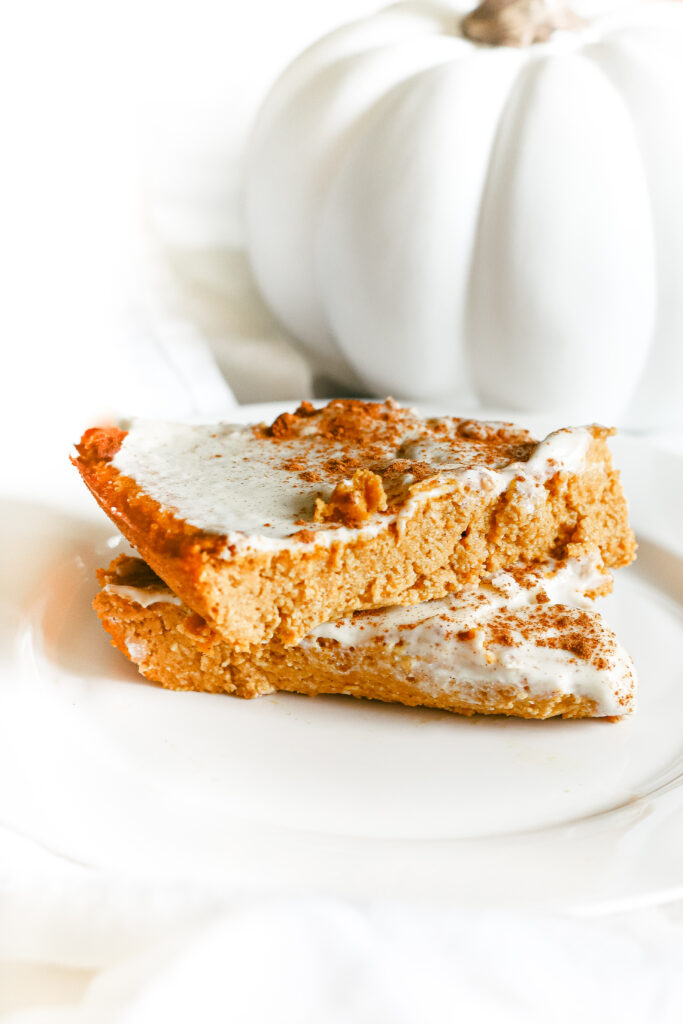 This pumpkin pie cake is just like the real thing, except homemade, healthy, and refined sugar free. The most scrumptious low carb and keto dessert for fall and Thanksgiving. Pumpkin Spice | Fall Recipes | Fall Desserts | Pumpkin Pie Dessert | Sugar Free | Gluten-Free | Autumn | Halloween | Thanksgiving | Pumpkin Cake | Snack | Healthy | Weight Loss | Ketogenic | Keto Pumpkin Recipe | Low Carbs | Crustless Pie |