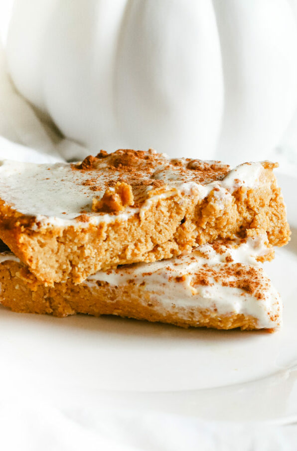 This pumpkin pie cake is just like the real thing, except homemade, healthy, and refined sugar free. The most scrumptious low carb and keto dessert for fall and Thanksgiving. Pumpkin Spice | Fall Recipes | Fall Desserts | Pumpkin Pie Dessert | Sugar Free | Gluten-Free | Autumn | Halloween | Thanksgiving | Pumpkin Cake | Snack | Healthy | Weight Loss | Ketogenic | Keto Pumpkin Recipe | Low Carbs | Crustless Pie |