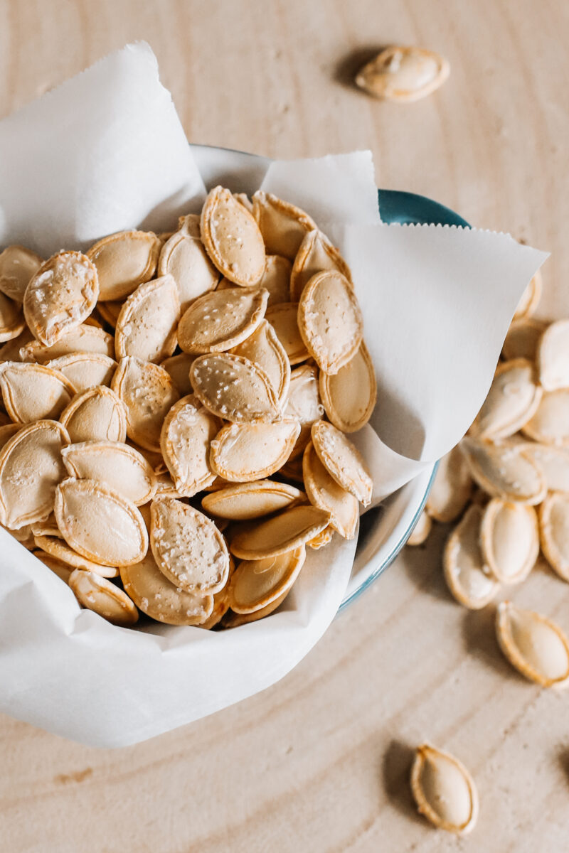 This Easy Salted Roasted Pumpkin Seeds recipe is a delicious and healthy snack after carving pumpkins! A fall and Thanksgiving family tradition you'll want to make year after year with the family!