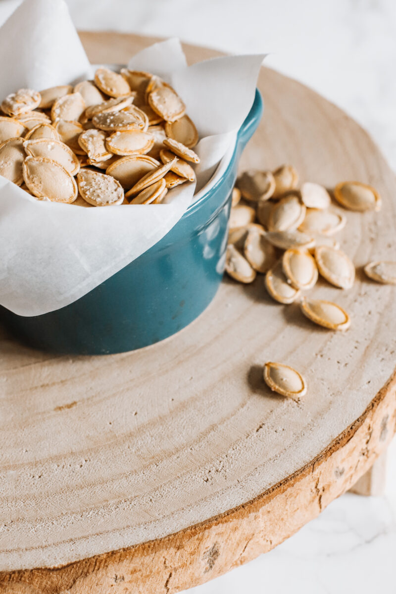 This Easy Salted Roasted Pumpkin Seeds recipe is a delicious and healthy snack after carving pumpkins! A fall and Thanksgiving family tradition you'll want to make year after year with the family!