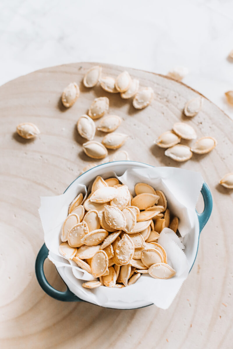 This Easy Salted Roasted Pumpkin Seeds recipe is a delicious and healthy snack after carving pumpkins! A fall and Thanksgiving family tradition you'll want to make year after year with the family!