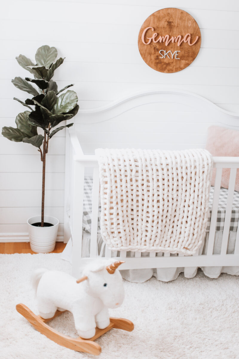 Our baby girl's nursery reveal is here! A sweet and simple modern farmhouse design with a shiplap accent wall and neutral decor. Here are all of the details! Gender Neutral | Farmhouse Nursery | Shiplap Crib | All White Nursery | Baby's Name | Wooden Sign | Chunky Knit Chenille Blanket | Home Design | Interior | Northern Living | Canadian Living | Canadian Small Shops | Small Businesses | Baby's Room |