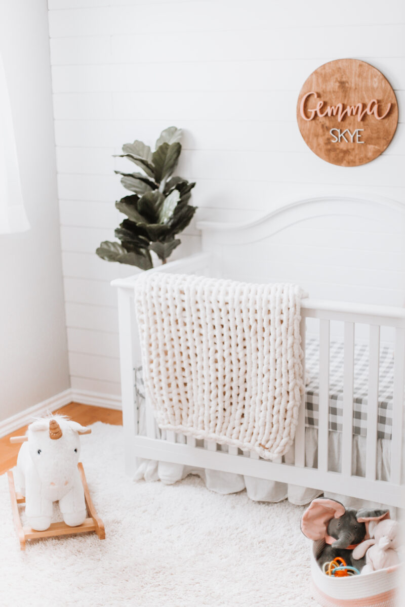 Our baby girl's nursery reveal is here! A sweet and simple modern farmhouse design with a shiplap accent wall and neutral decor. Here are all of the details! Gender Neutral | Farmhouse Nursery | Shiplap Crib | All White Nursery | Baby's Name | Wooden Sign | Chunky Knit Chenille Blanket | Home Design | Interior | Northern Living | Canadian Living | Canadian Small Shops | Small Businesses | Baby's Room | Boho Nurseries |