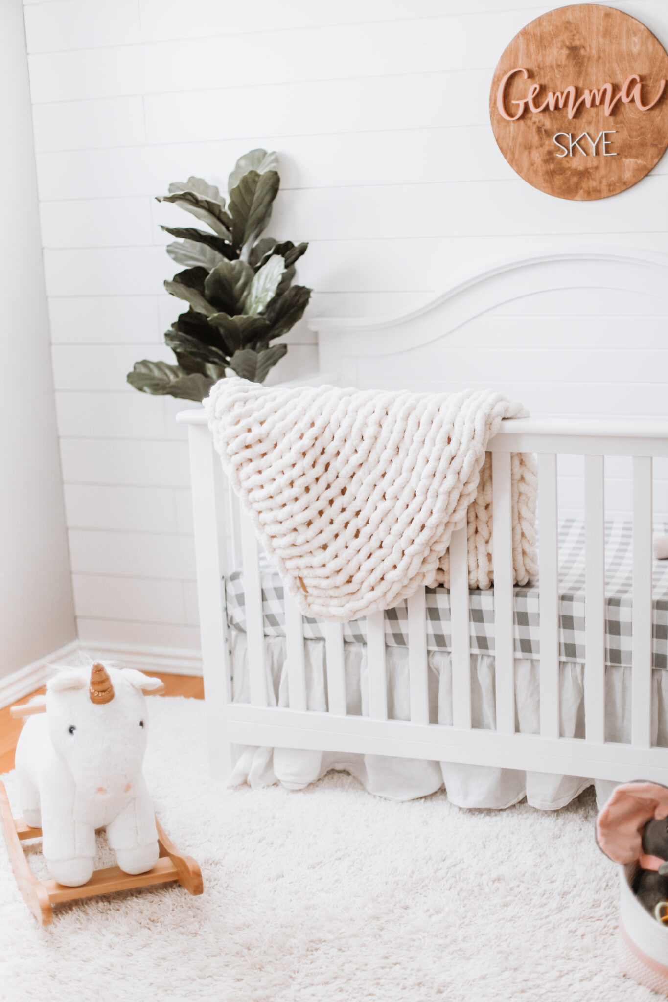 Our baby girl's nursery reveal is here! A sweet and simple modern farmhouse design with a shiplap accent wall and neutral decor. Here are all of the details! Gender Neutral | Farmhouse Nursery | Shiplap Crib | All White Nursery | Baby's Name | Wooden Sign | Chunky Knit Chenille Blanket | Home Design | Interior | Northern Living | Canadian Living | Canadian Small Shops | Small Businesses | Baby's Room | Boho Nurseries |