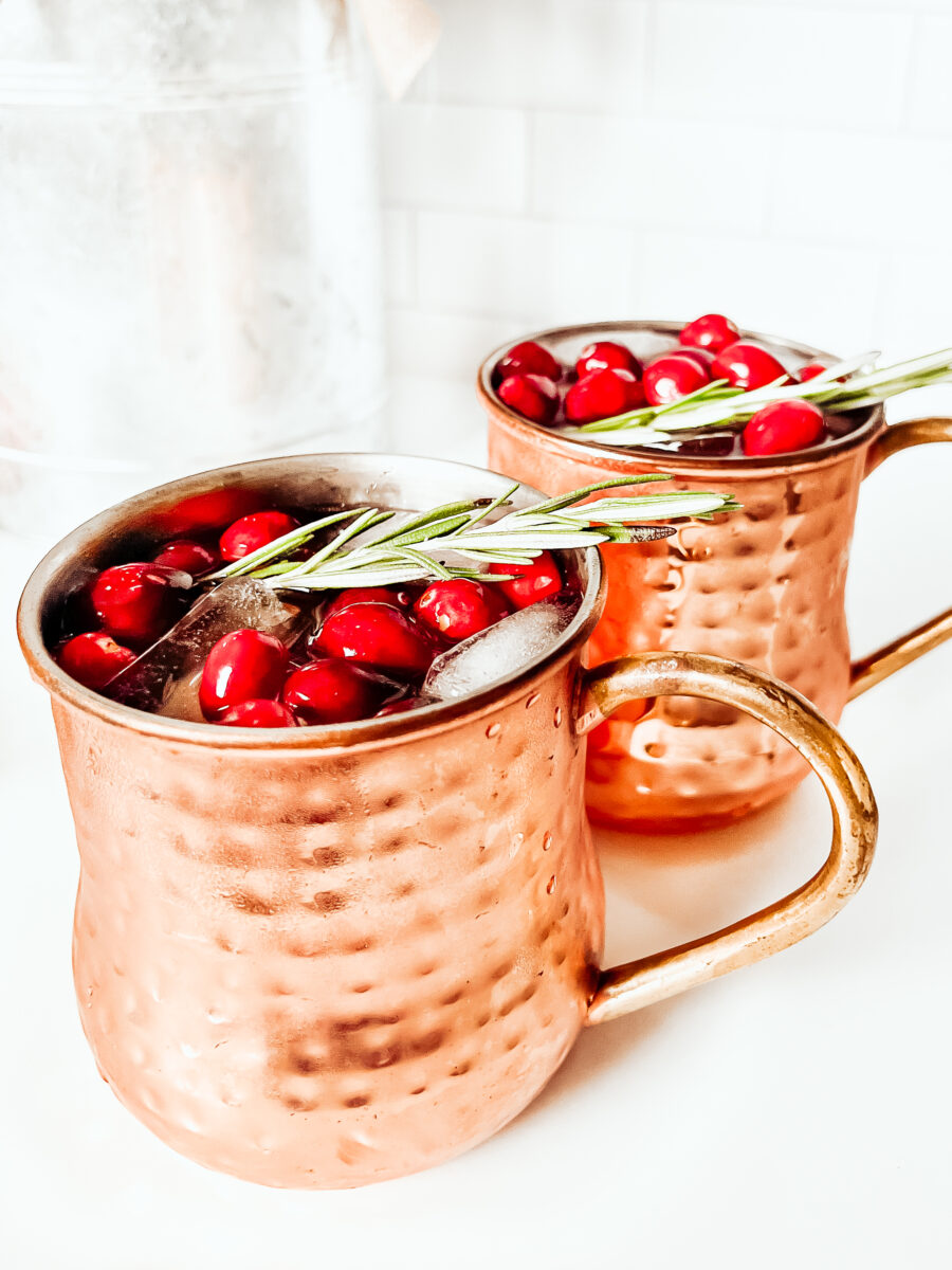 This Cranberry Moscow Mule in a copper mug is a festive cocktail for Christmas that's sugar free, keto friendly, gluten-free and low carb. A refreshing drink to keep you relaxed while staying on track this holiday season. Christmas Recipe | Adult Beverages | Mocktail Version | Drinks | Cocktails | Festive Drink | Christmas Drink | Keto Cocktail | Keto Moscow Mule | 