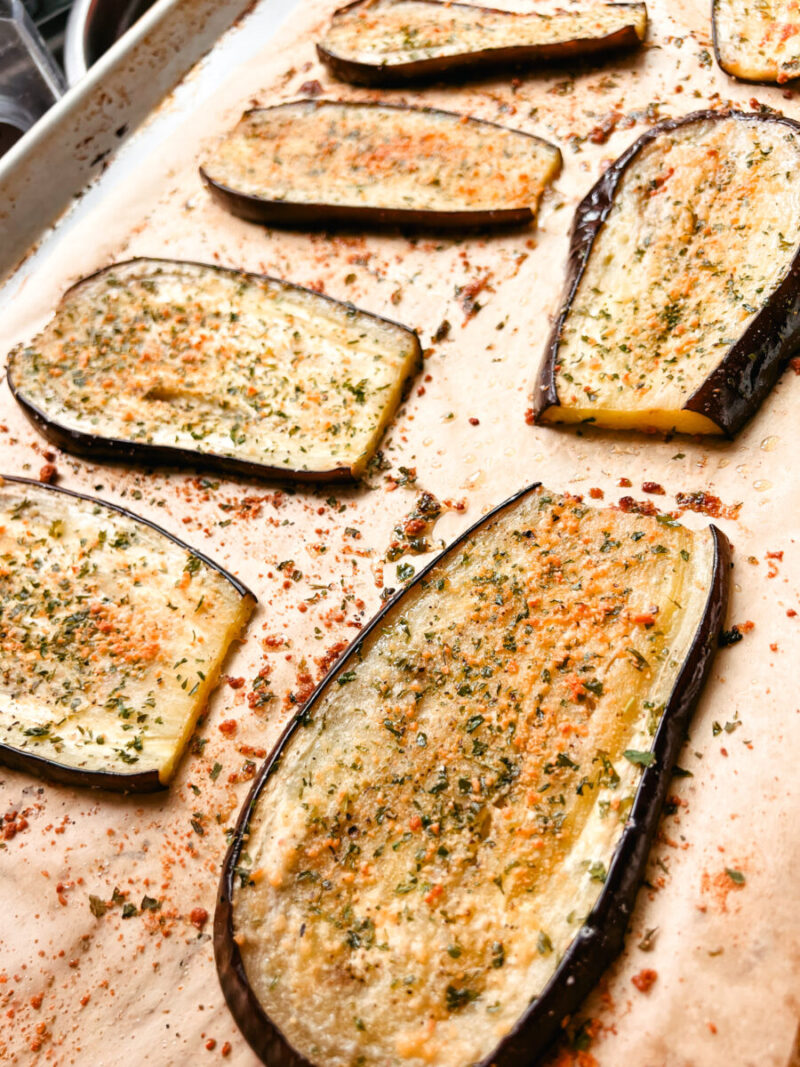 This Oven Roasted Eggplant with garlic and parmesan is baked to perfection and served with a Mediterranean dip. Delicious, healthy, and a quick and easy dinner or side dish that's gluten-free, low carb and keto friendly. Dinner Recipes | Dinner Side Dish | Greek Recipes | Italian Recipes | Eggplant Recipe | Oven Baked | Homemade Dip | Appetizer | Healthy Meals | Easy Dinners 