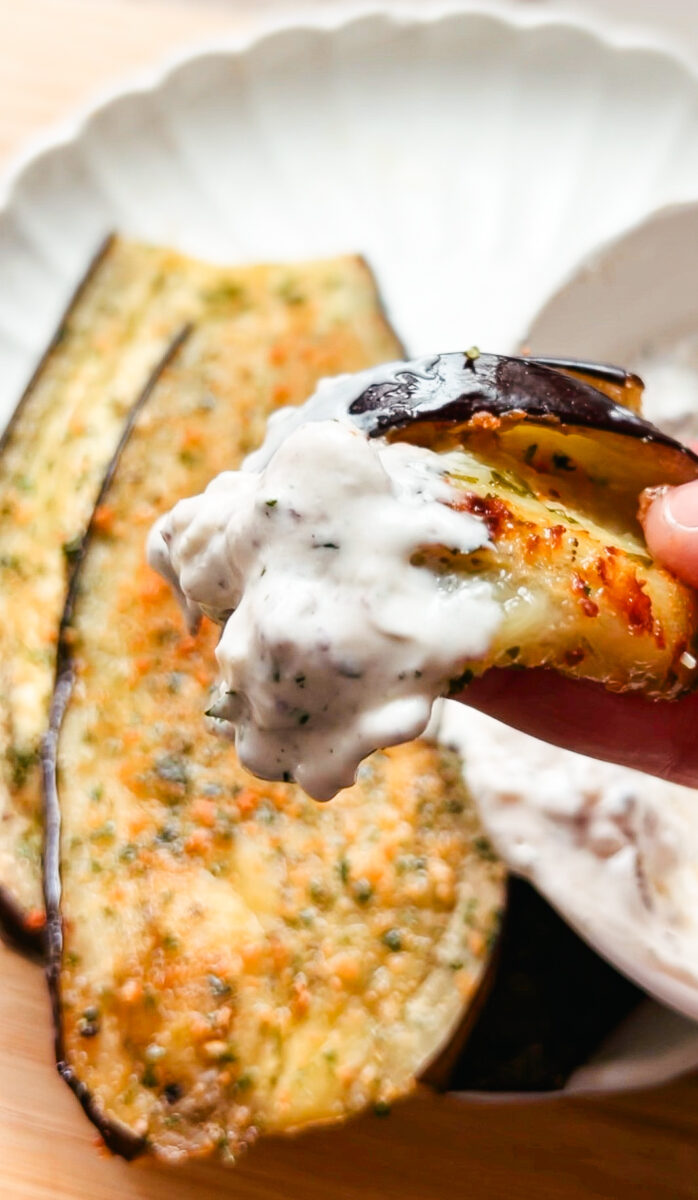 This Oven Roasted Eggplant with garlic and parmesan is baked to perfection and served with a Mediterranean dip. Delicious, healthy, and a quick and easy dinner or side dish that's gluten-free, low carb and keto friendly. Dinner Recipes | Dinner Side Dish | Greek Recipes | Italian Recipes | Eggplant Recipe | Oven Baked | Homemade Dip | Appetizer | Healthy Meals | Easy Dinners
