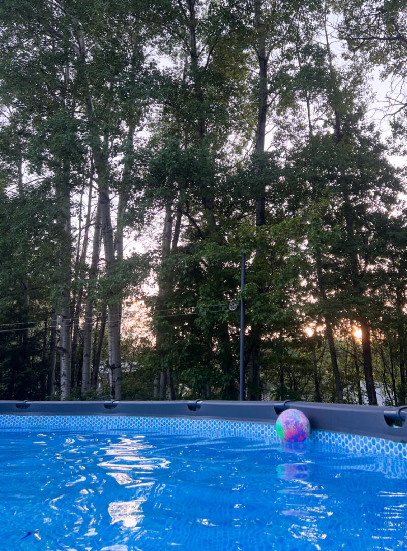 sunset through trees view from Intex Ultra XTR 24ft above ground pool 