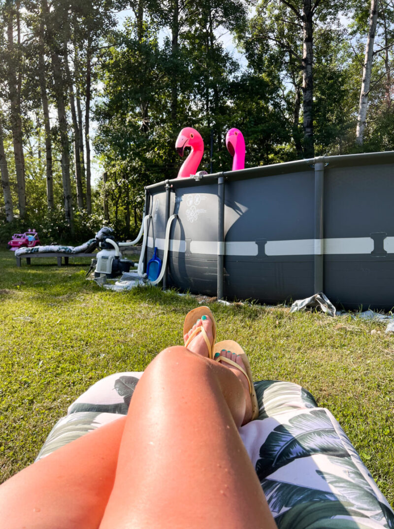 Relaxing on a chaise lounge chair in the backyard beside our Intex Ultra XTR 24ft pool