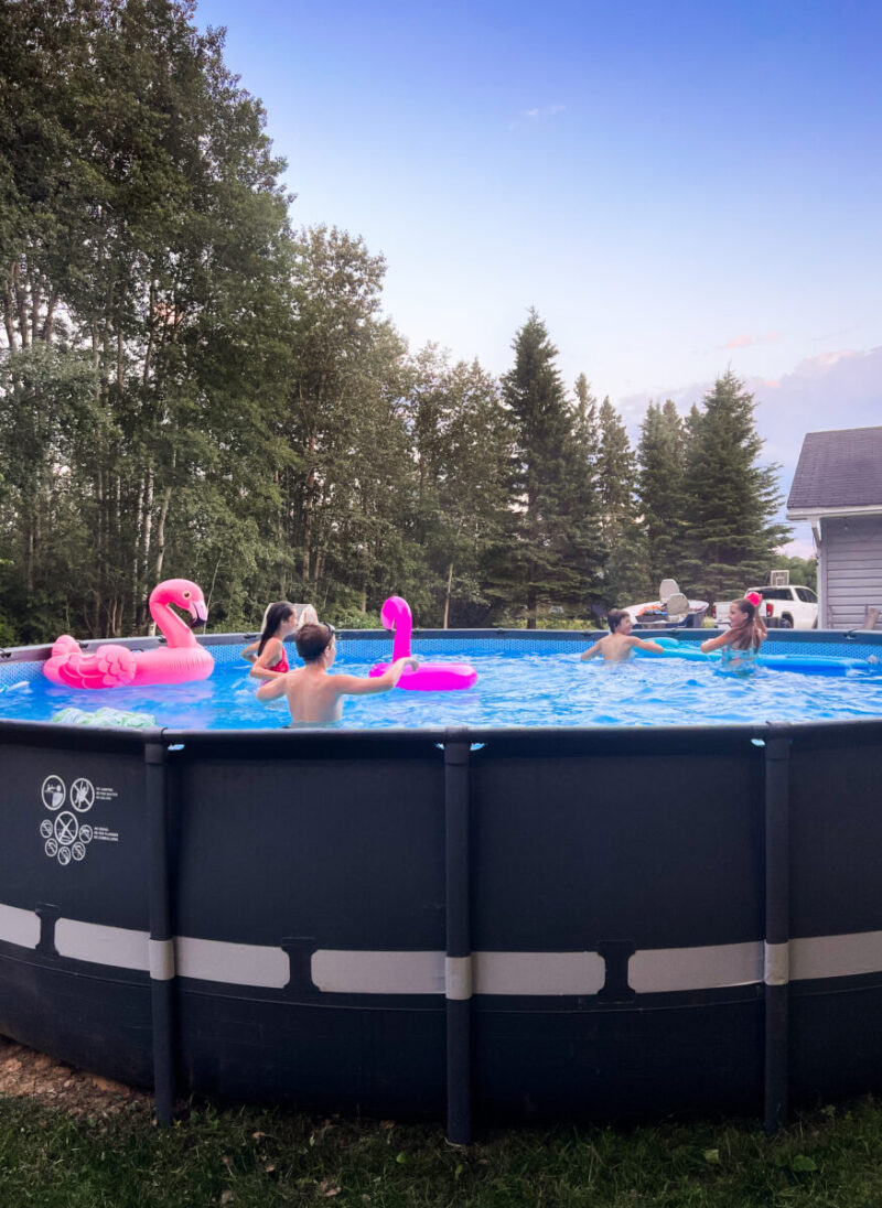 kids and friends enjoying our Intex Ultra XTR 24ft above ground pool on a summer day